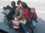 family_with_baby_on_motorcycle-300x218.jpg