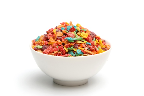 White ceramic bowl holding colorful tiny bits of cereal